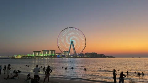 Dubai UAE July 7 2026 JBR beach sunset and camel ride at Dubai Marina Stock Footage 338388637