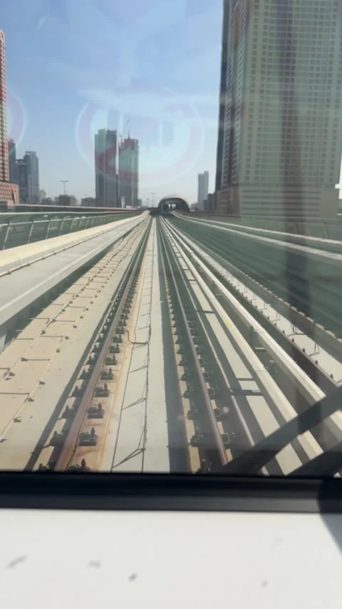 Dubai UAE July 7 2026 Sunset view from Dubai Metro overlooking city skyline Stock Footage 338391109