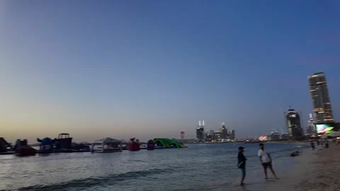 Dubai, UAE - June 02, 2026: Tourists and locals enjoying a sunset walk at J.. Stock Footage 336175372