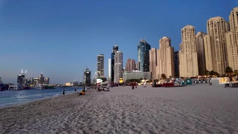 Dubai, UAE - June 02, 2026: Tourists and locals enjoying a sunset walk at J.. Stock Footage 336175631