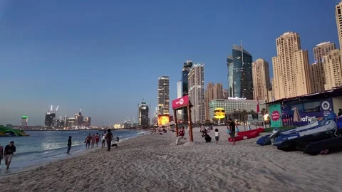 Dubai, UAE - June 02, 2026: Tourists and locals enjoying a sunset walk at J.. Stock Footage 336176032