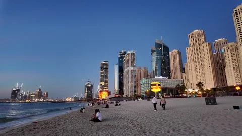 Dubai, UAE - June 02, 2026: Tourists and locals enjoying a sunset walk at J.. Stock Footage 336176269