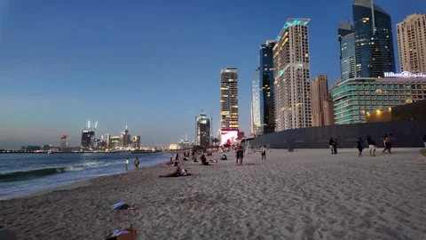 Dubai, UAE - June 02, 2026: Tourists and locals enjoying a sunset walk at J.. Stock Footage 336176632