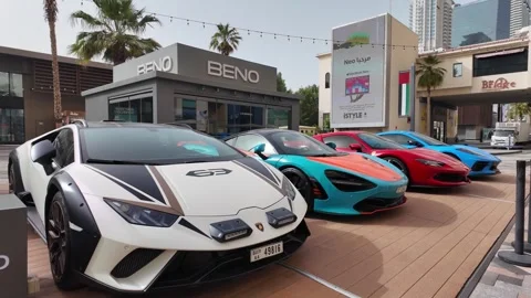 Dubai, UAE - June 02, 2026: Row of luxury supercars including Lamborghini, .. Stock Footage 336182986