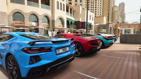 Dubai, UAE - June 02, 2026: Row of luxury supercars including Lamborghini, .. Stock Footage 336183289