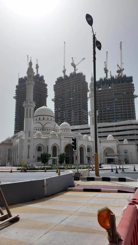 Dubai, UAE - June 11, 2026: Mosque and urban construction. Stock Footage 336717715