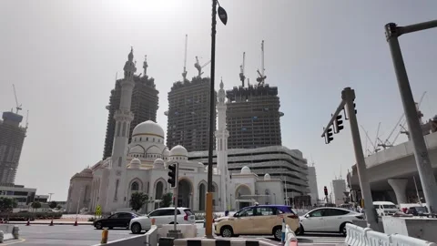 Dubai, UAE - June 11, 2026: Mosque and urban construction. Stock Footage 336717780