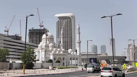 Dubai, UAE - June 11, 2026: Mosque and urban construction. Stock Footage 336717853