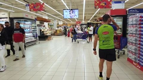 Dubai, UAE, June-16, 2025:  Shoppers in a Dubai supermarket browse aisles, se Video stock 312824941