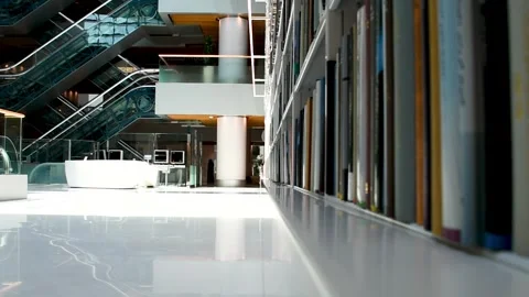 Dubai, UAE - June 19, 2024: Close-up of books on shelves in Library. Stock Footage 279877491