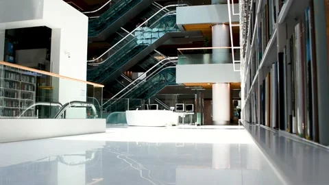 Dubai, UAE - June 19, 2024: Close-up of books on shelves in the Library. Stock Footage 279877497