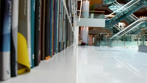 Dubai, UAE - June 19, 2024: Close-up of books on shelves in the Library. Stock Footage 279877508
