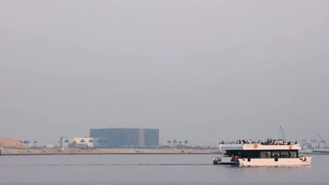 Dubai, UAE - June 20, 2024: Tourists on a ferry tour in the Creek area in Dubai. Video stock 279877904
