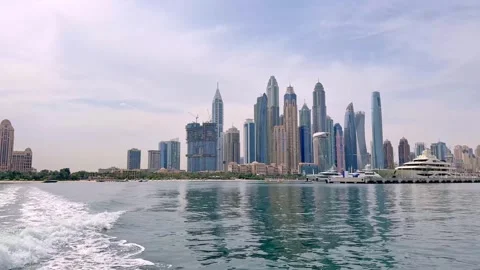 Dubai, UAE, June 9, 2025. Stunning waterfront view of Dubai Marina skyscrapers Stock Footage 310996191