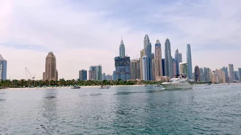 Dubai, UAE, June 9, 2025. Stunning waterfront view of Dubai Marina skyscrapers Stock Footage 310996242