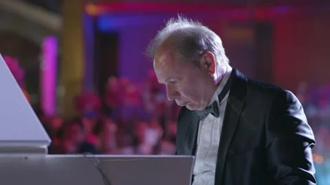 DUBAI, UAE - MARCH 7, 2020: Pianist virtuoso Yury Rozum plays white grand piano Stock Footage 134899071