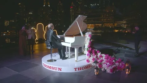 DUBAI, UAE - MARCH 7, 2020: Pianist virtuoso Yury Rozum plays white grand piano Stock Footage 134899250
