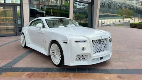 DUBAI, UAE - MAY 05, 2026: Luxury Rolls Royce cars including white and two-.. Stock Footage 334116400