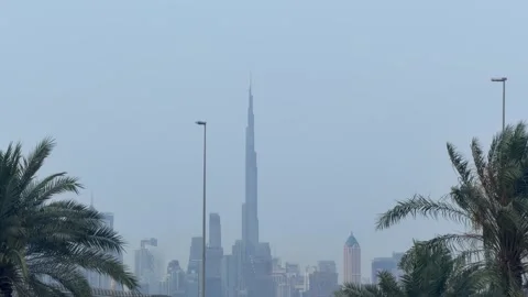 DUBAI, UAE - MAY 05, 2026: Long distance view of Burj Khalifa and Dubai sky.. Stock Footage 334125468
