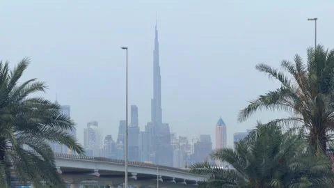 DUBAI, UAE - MAY 05, 2026: Long distance view of Burj Khalifa and Dubai sky.. Stock Footage 334125563