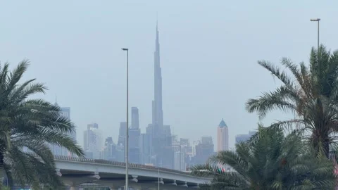 DUBAI, UAE - MAY 05, 2026: Long distance view of Burj Khalifa and Dubai sky.. Stock Footage 334125598
