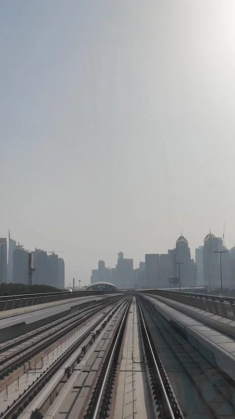 DUBAI, UAE - MAY 12, 2026: POV front view from a moving Dubai Metro train o.. Stock Footage 334715387