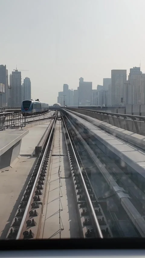DUBAI, UAE - MAY 12, 2026: POV front view from a moving Dubai Metro train o.. Stock Footage 334715546