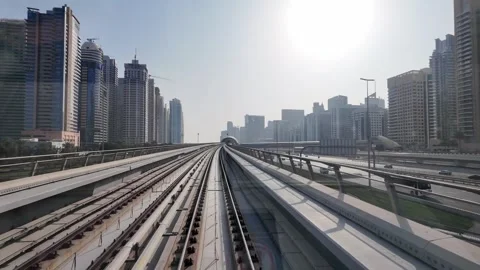 DUBAI, UAE - MAY 12, 2026: POV front view from a moving Dubai Metro train o.. Stock Footage 334715755