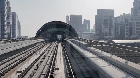 DUBAI, UAE - MAY 12, 2026: POV front view from a moving Dubai Metro train o.. Stock Footage 334716097