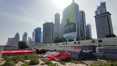 DUBAI, UAE - MAY 13, 2026: Construction site with crane and materials. Stock Footage 334767863