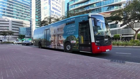 DUBAI, UAE - MAY 13, 2026: RTA public transport bus on the city street. Stock Footage 334768915