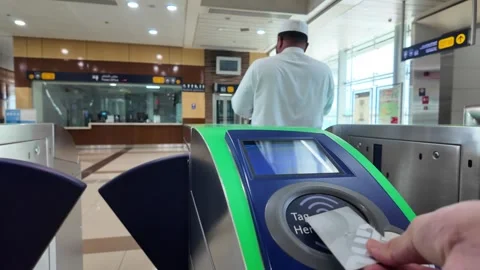 DUBAI, UAE - MAY 13, 2026: People using Dubai Metro escalator, interior com.. Stock Footage 334769998