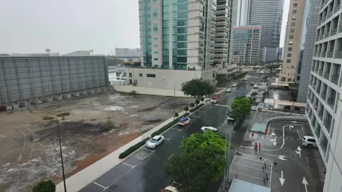 DUBAI, UAE - MAY 14, 2026: Heavy rain falling over city streets and skyscra.. Stock Footage 334875903