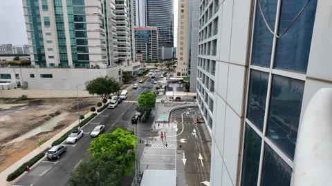 DUBAI, UAE - MAY 14, 2026: Heavy rain falling over city streets and skyscra.. Stock Footage 334876573