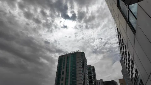 DUBAI, UAE - MAY 14, 2026: Heavy rain falling over city streets and skyscra.. Stock Footage 334876665