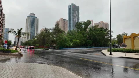 DUBAI, UAE - MAY 14, 2026: Heavy rain falling over city streets and skyscra.. Stock Footage 334876907