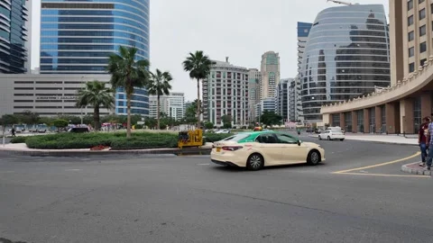 DUBAI, UAE - MAY 14, 2026: Municipal workers using water tankers and pumps .. Stock Footage 334921307