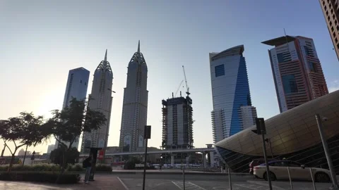 DUBAI, UAE - MAY 15, 2026: People walking and cycling in the modern urban d.. Stock Footage 334922336
