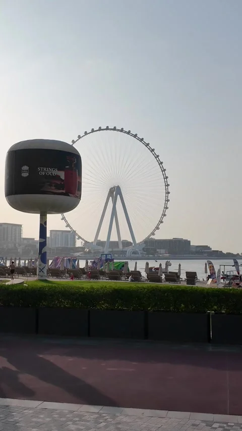 DUBAI, UAE - MAY 15, 2026: Scenic view of Ain Dubai ferris wheel and JBR sk.. Stock Footage 334930019