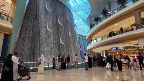 DUBAI, UAE - MAY 16, 2026: Cinematic shot of the indoor waterfall inside Du.. Stock Footage 335021422