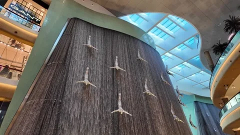 DUBAI, UAE - MAY 16, 2026: Cinematic shot of the indoor waterfall inside Du.. Stock Footage 335021711