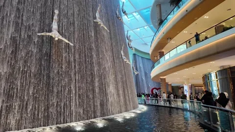 DUBAI, UAE - MAY 16, 2026: Cinematic shot of the indoor waterfall inside Du.. Stock Footage 335021870