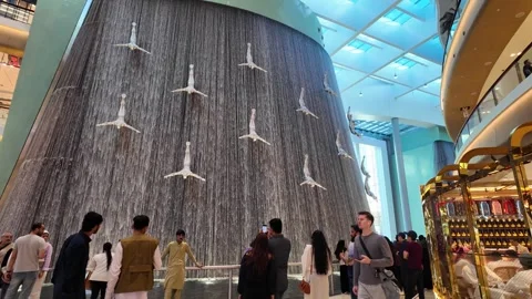 DUBAI, UAE - MAY 16, 2026: Cinematic shot of the indoor waterfall inside Du.. Stock Footage 335021994