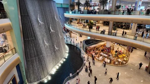 DUBAI, UAE - MAY 16, 2026: Cinematic shot of the indoor waterfall inside Du.. Stock Footage 335022134