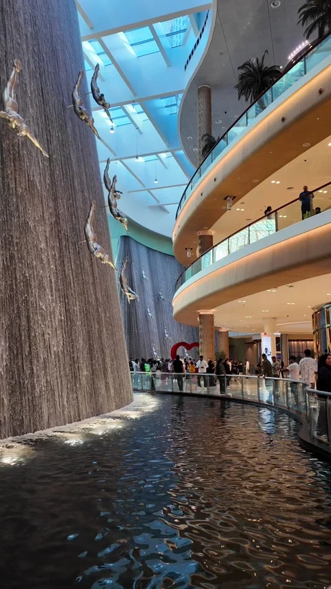 DUBAI, UAE - MAY 16, 2026: Cinematic shot of the indoor waterfall inside Du.. Stock Footage 335022686