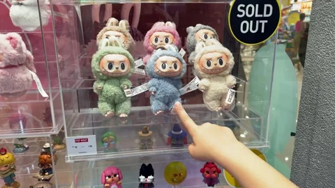 Dubai, UAE - May 18, 2025: Labubu plush toys from The Monsters by Pop Mart on Stock Footage 309509468