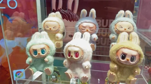 Dubai, UAE - May 18, 2025: Labubu plush toys from The Monsters by Pop Mart on Stock Footage 309509614