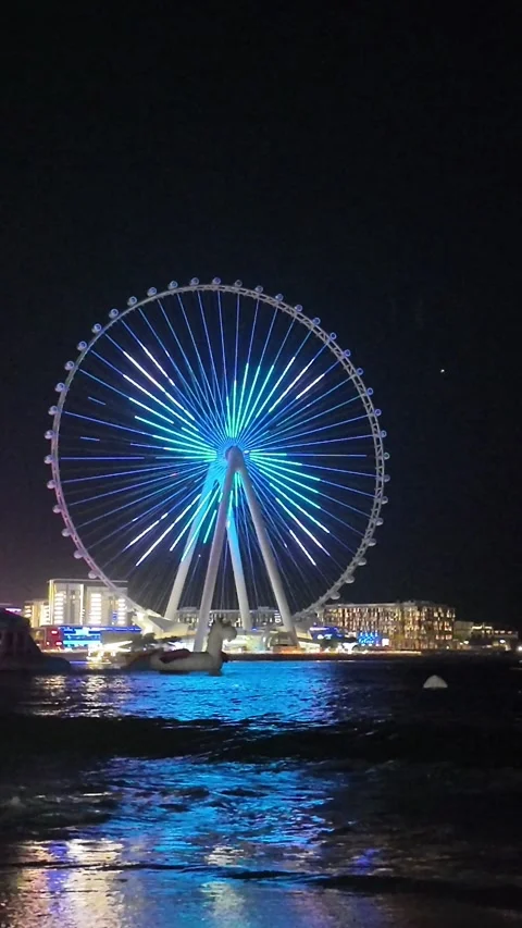 Dubai, UAE - May 24, 2026: Ain Dubai Ferris wheel illuminated at night, Blu.. Stock Footage 335550294