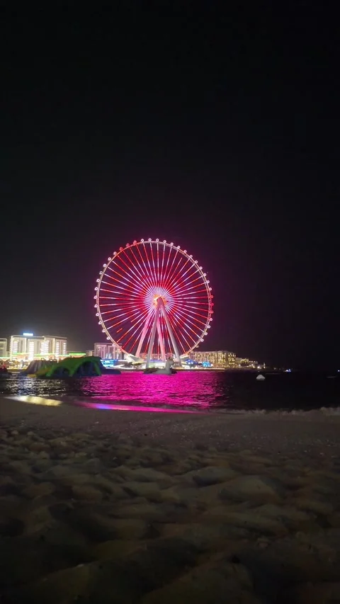 Dubai, UAE - May 24, 2026: Ain Dubai Ferris wheel illuminated at night, Blu.. Stock Footage 335550467