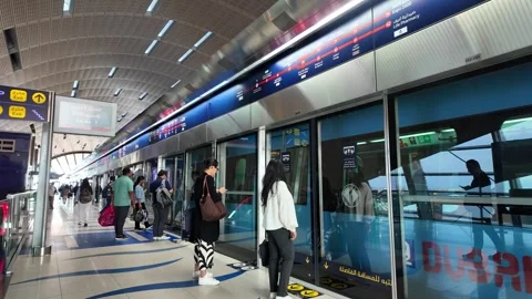 Dubai, UAE - May 26, 2026: Dubai Marina Tram passing through modern skyscra.. Stock Footage 335694858